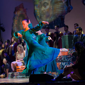 A student dancing. Links to Donor-Advised Funds