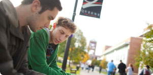 Photo of two students outdoors