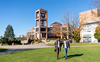 Photo of students wakling on campus. Link to Beneficiary Designations.